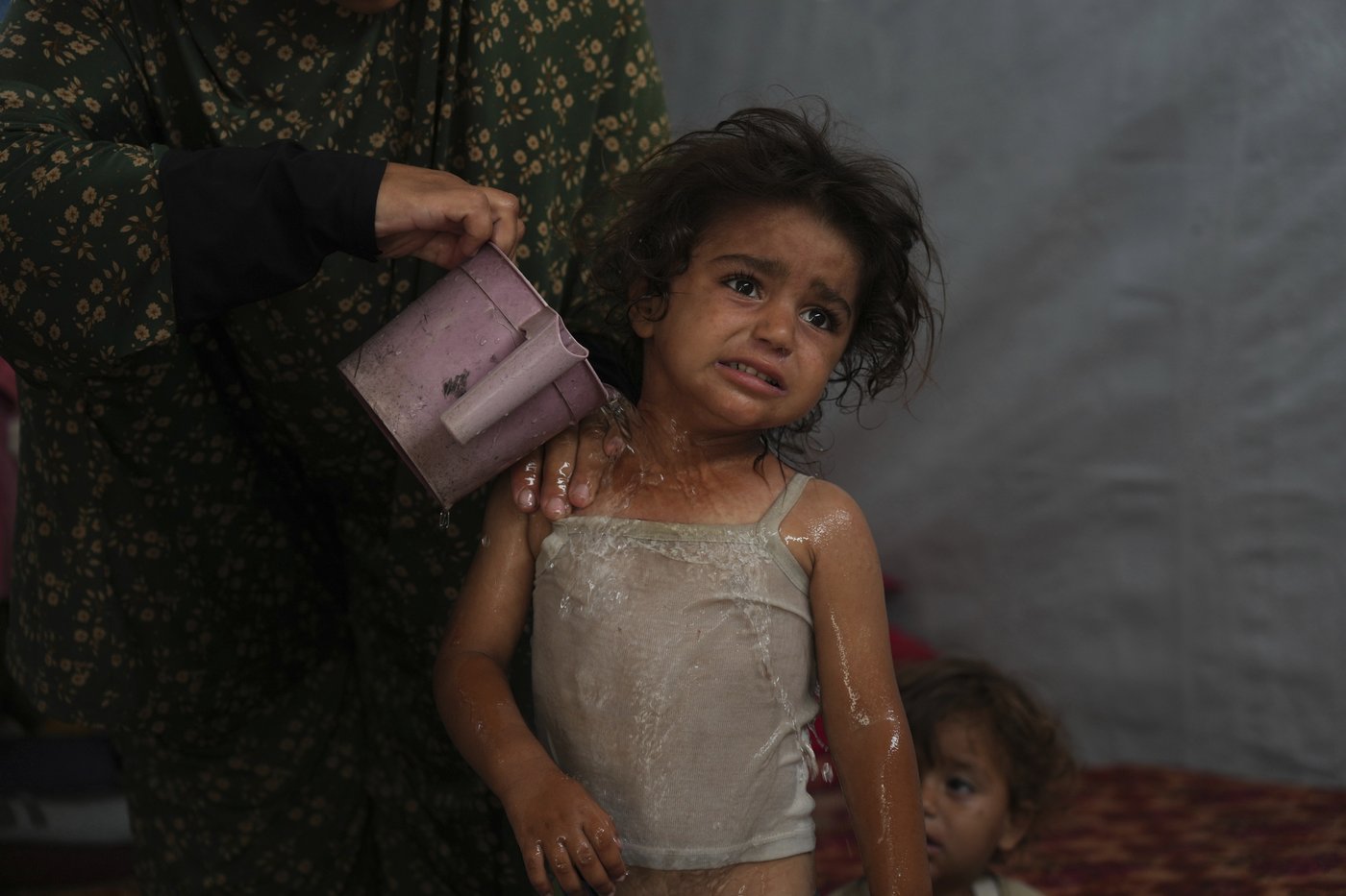 Palestinians walk long distances to fetch water and ration each drop. The heat is making it worse | iNFOnews.ca