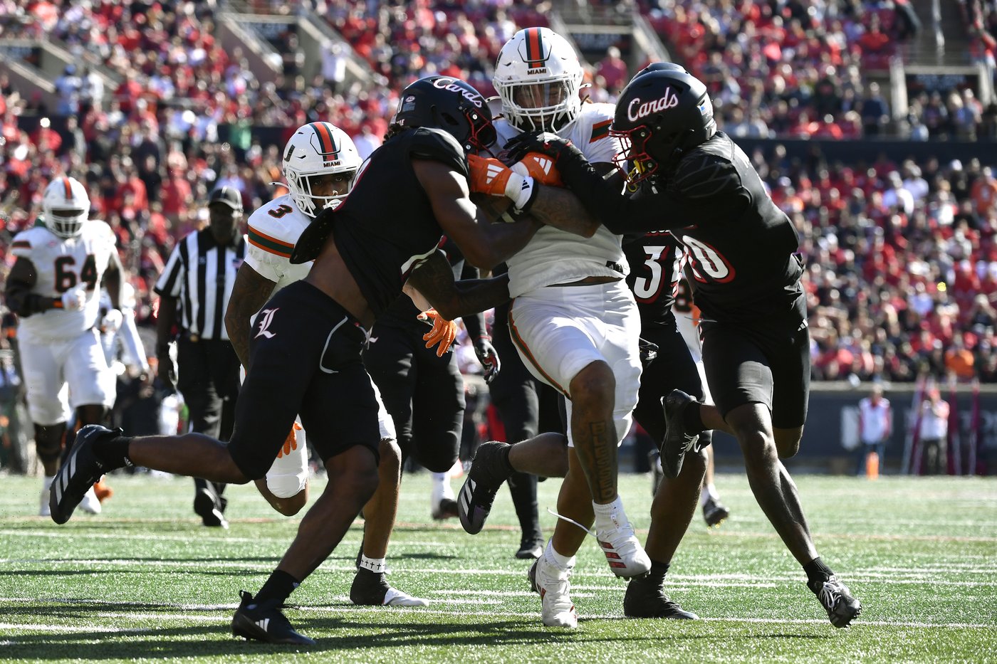 Cam Ward throws for 4 touchdowns, No. 6 Miami survives Louisville comeback bids for wild 52-45 win | iNFOnews.ca Cam Ward throws for 4 touchdowns, No. 6 Miami survives Louisville comeback bids for wild 52-45 win | iNFOnews.ca