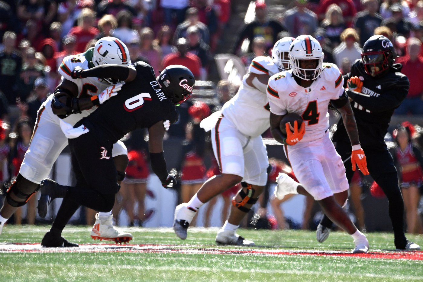 Cam Ward throws for 4 touchdowns, No. 6 Miami survives Louisville comeback bids for wild 52-45 win | iNFOnews.ca Cam Ward throws for 4 touchdowns, No. 6 Miami survives Louisville comeback bids for wild 52-45 win | iNFOnews.ca