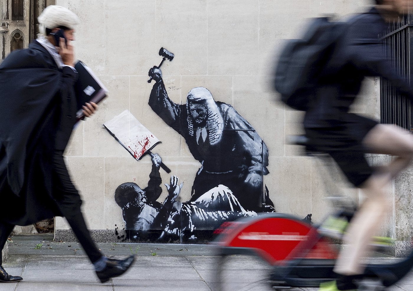 Banksy mural of a judge beating a protester is scrubbed from London court | iNFOnews.ca Banksy mural of a judge beating a protester is scrubbed from London court | iNFOnews.ca