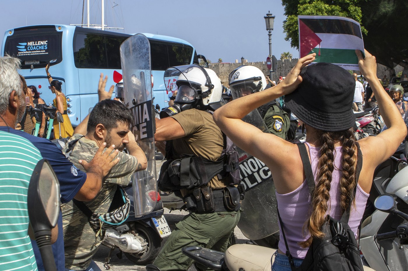 Riot police scuffle with demonstrators on Greek island during visit by Israeli cruise ship | iNFOnews.ca Riot police scuffle with demonstrators on Greek island during visit by Israeli cruise ship | iNFOnews.ca