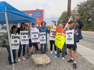 Striking workers with picket signs