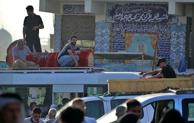 Families lay to rest loved ones after deadly Baghdad blast | iNFOnews.ca Families lay to rest loved ones after deadly Baghdad blast | iNFOnews.ca
