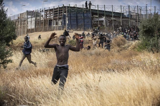 Deaths rise to 23 from mass attempt to enter Spanish enclave | iNFOnews.ca Deaths rise to 23 from mass attempt to enter Spanish enclave | iNFOnews.ca
