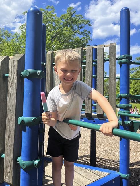 8-year-old paralyzed in parade attack awake, asking for twin | iNFOnews.ca