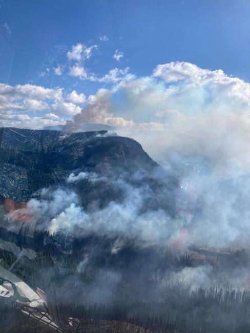 Crews keep close watch on one B.C. wildfire, as another delays school in northeast | iNFOnews.ca
