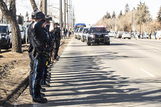 Procession for Edmonton police officers shot and killed responding to call | iNFOnews.ca