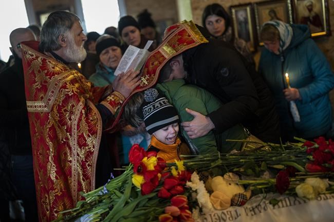 Relatives bury children killed in Russian missile attack | iNFOnews.ca