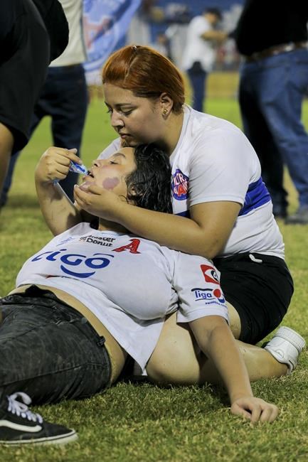 Angry fans crash through gate at El Salvador soccer match in stampede that kills 12, injures dozens | iNFOnews.ca
