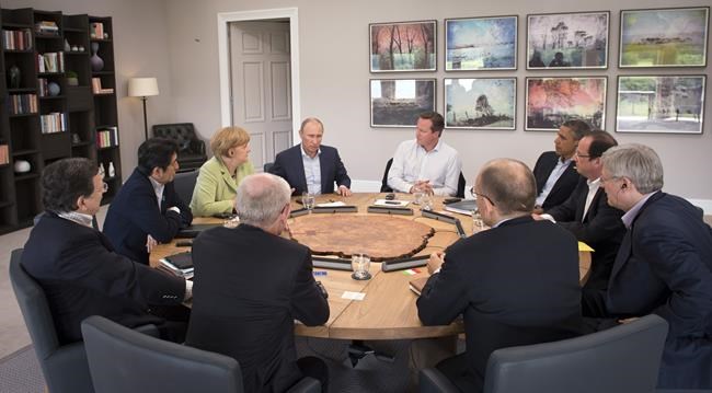 World summits' 'family photos' show Putin's isolation | iNFOnews.ca