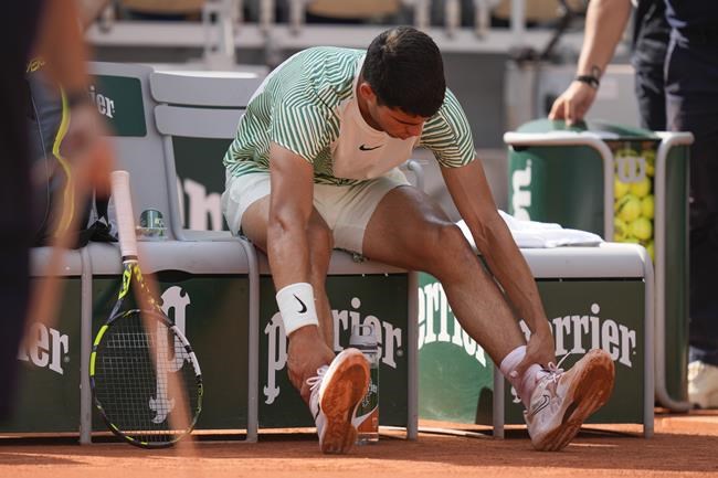 Carlos Alcaraz hits stunning shot before cramps; Novak Djokovic wins their French Open semifinal | iNFOnews.ca