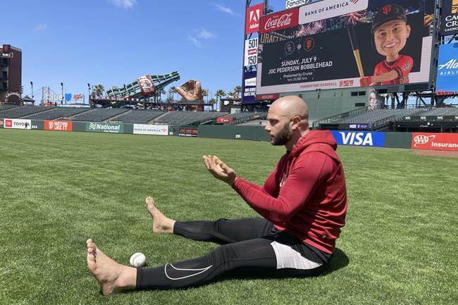 Baseball players are staying mindful on the diamond with barefoot walks in the grass | iNFOnews.ca