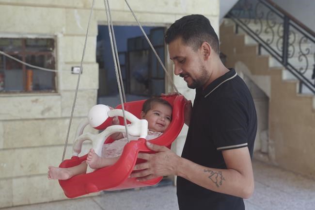 Syrian baby born under earthquake rubble turns 6 months, happily surrounded by her adopted family | iNFOnews.ca