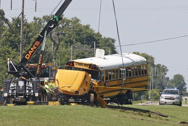 An Ohio school bus overturns after crash with minivan, leaving 1 child dead and 23 injured | iNFOnews.ca An Ohio school bus overturns after crash with minivan, leaving 1 child dead and 23 injured | iNFOnews.ca