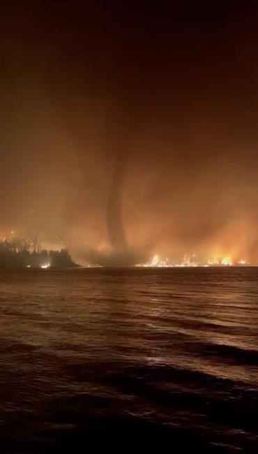 Video captures 'incredibly rare' B.C. wildfire tornado over lake | iNFOnews.ca