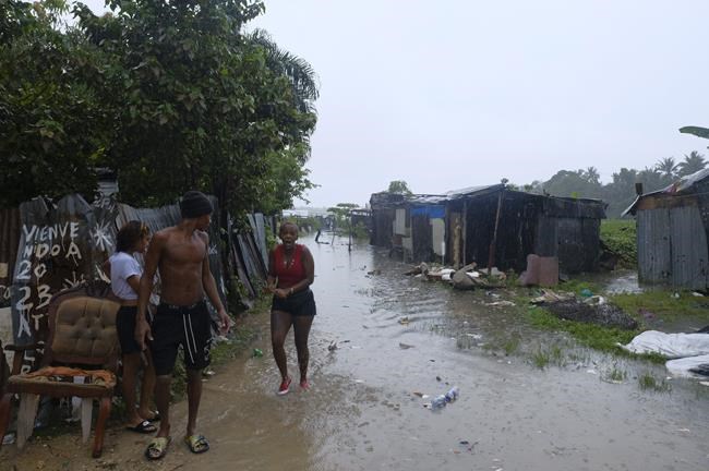 Dominican officials inspect damage inflicted by Tropical Storm Franklin after heavy flooding kills 2 | iNFOnews.ca
