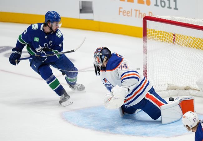 Hughes helps Canucks power past Oilers 5-2 | iNFOnews.ca