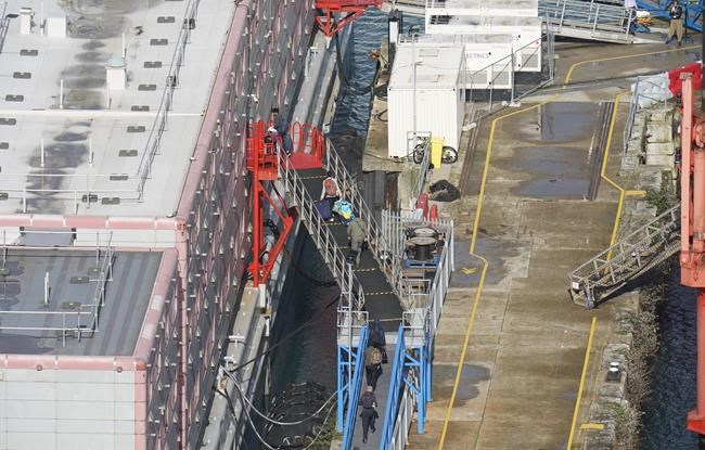 Asylum seekers return to a barge off England's south coast following legionella evacuation | iNFOnews.ca