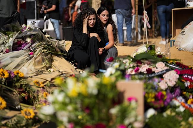 Burying friends, updating death lists: The morbid routine of displaced survivors of a Hamas massacre | iNFOnews.ca