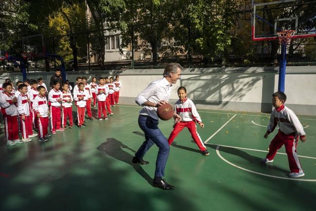 California's Newsom plays hardball in China, collides with student during schoolyard basketball game | iNFOnews.ca