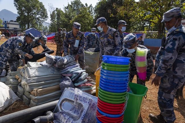 Aid trickles in as survivors salvage belongings from rubble in Nepal villages struck by earthquake | iNFOnews.ca