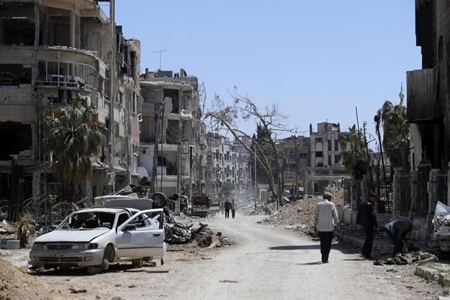 Members of global chemical weapons watchdog vote to keep Syria from getting poison gas materials | iNFOnews.ca