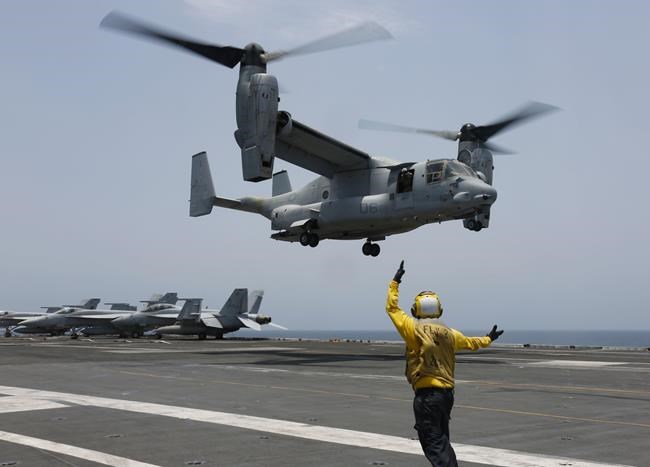 Divers recover the seventh of 8 crew members killed in crash of a US military Osprey off Japan | iNFOnews.ca