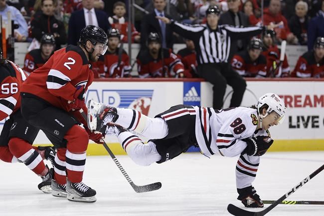 Blackhawks' Bedard leaves game against Devils after hit from Smith | iNFOnews.ca Blackhawks' Bedard leaves game against Devils after hit from Smith | iNFOnews.ca