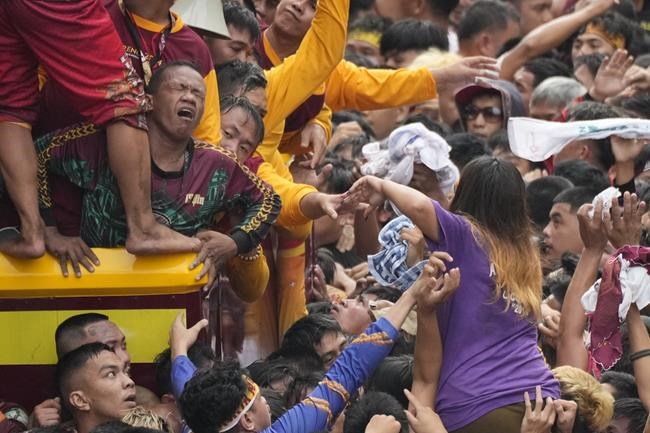 Filipino Catholics pray for Mideast peace in massive procession venerating a black statue of Jesus | iNFOnews.ca Filipino Catholics pray for Mideast peace in massive procession venerating a black statue of Jesus | iNFOnews.ca