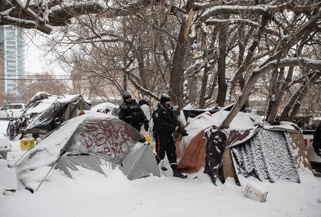 Three people, including reporter, arrested as Edmonton encampment dismantled | iNFOnews.ca