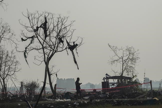 Remains of fireworks explosion victims taken to Thai temple where families give DNA to identify them | iNFOnews.ca Remains of fireworks explosion victims taken to Thai temple where families give DNA to identify them | iNFOnews.ca