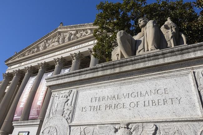 National Archives working to clean up red powder dumped on Constitution display by protesters | iNFOnews.ca