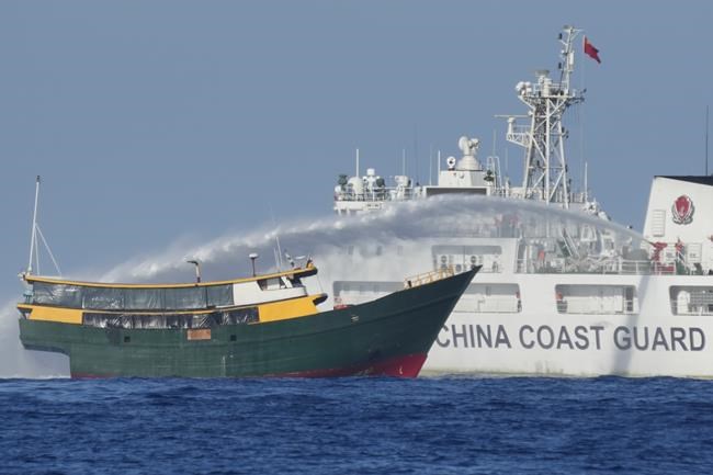 China coast guard flexes its might against the Philippines in disputed waters as journalists look on | iNFOnews.ca China coast guard flexes its might against the Philippines in disputed waters as journalists look on | iNFOnews.ca