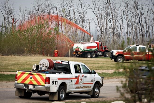 'Day by day': Alberta fire evacuees out until next week, weather to help B.C. crews | iNFOnews.ca