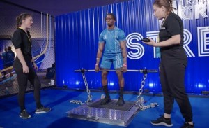 An athlete pulling on an isometric deadlift set up.