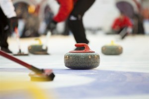 A close-up shot of a curling match.