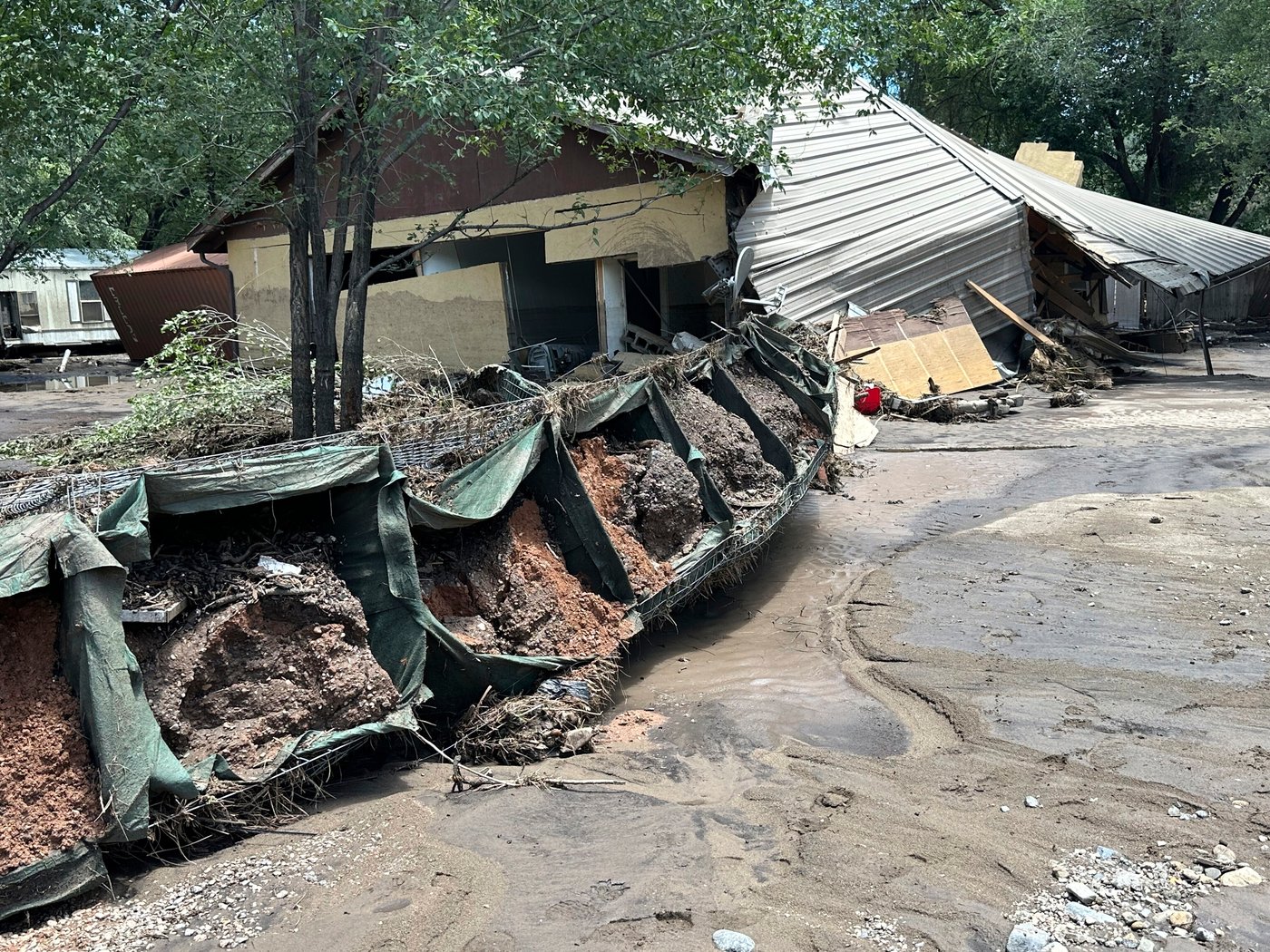 Flash flooding that killed 3 leaves New Mexico village heartbroken, anxious as cleanup begins | iNFOnews.ca Flash flooding that killed 3 leaves New Mexico village heartbroken, anxious as cleanup begins | iNFOnews.ca