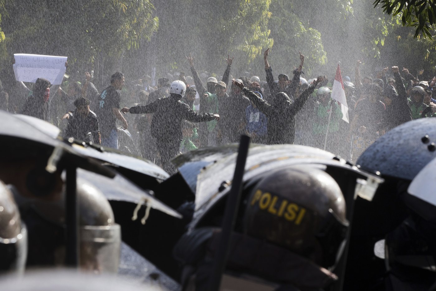 Photos of violent clashes between riot police and protesters in Indonesia | iNFOnews.ca