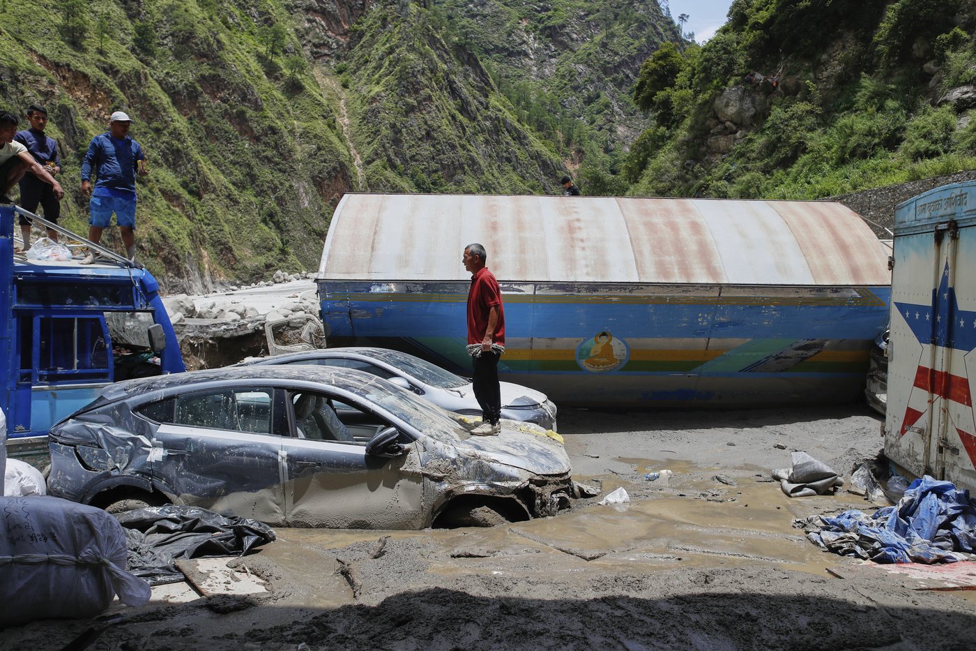 Rescuers search for 19 missing and recover 9 bodies after flooding in Nepal | iNFOnews.ca