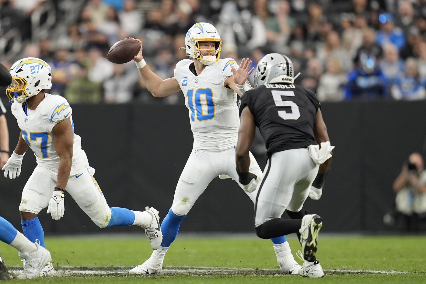 Harbaugh back in Houston for playoffs a year after winning college title when Chargers visit Texans | iNFOnews.ca