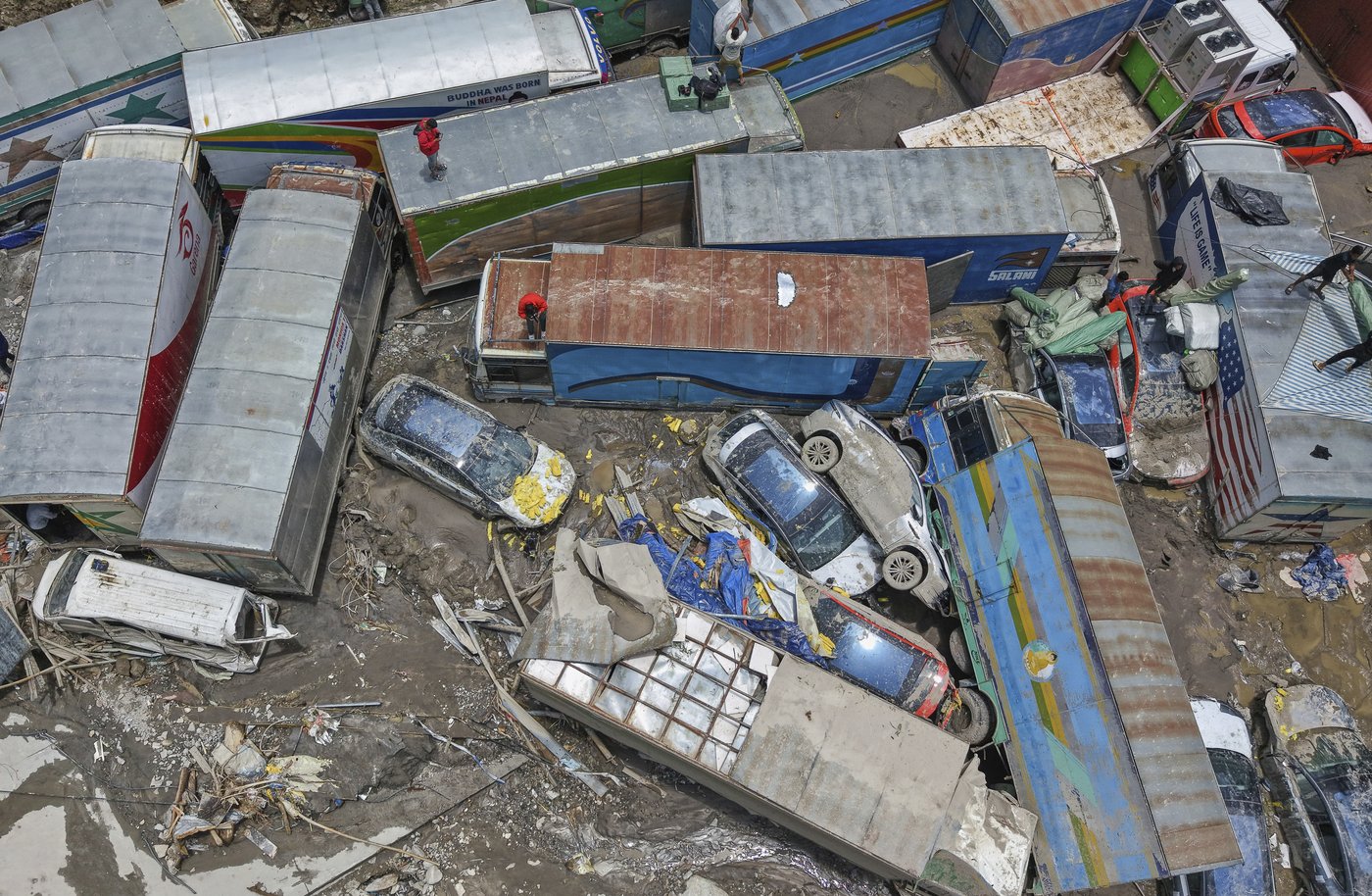 Rescuers search for 19 missing and recover 9 bodies after flooding in Nepal | iNFOnews.ca