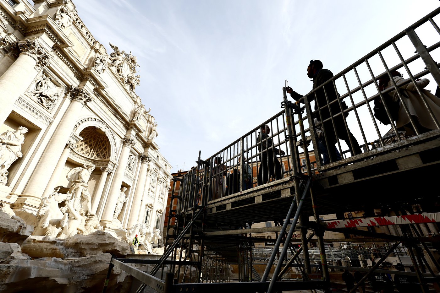 Tourists in Rome now have a walkway to visit the Trevi Fountain but can't toss coins | iNFOnews.ca Tourists in Rome now have a walkway to visit the Trevi Fountain but can't toss coins | iNFOnews.ca