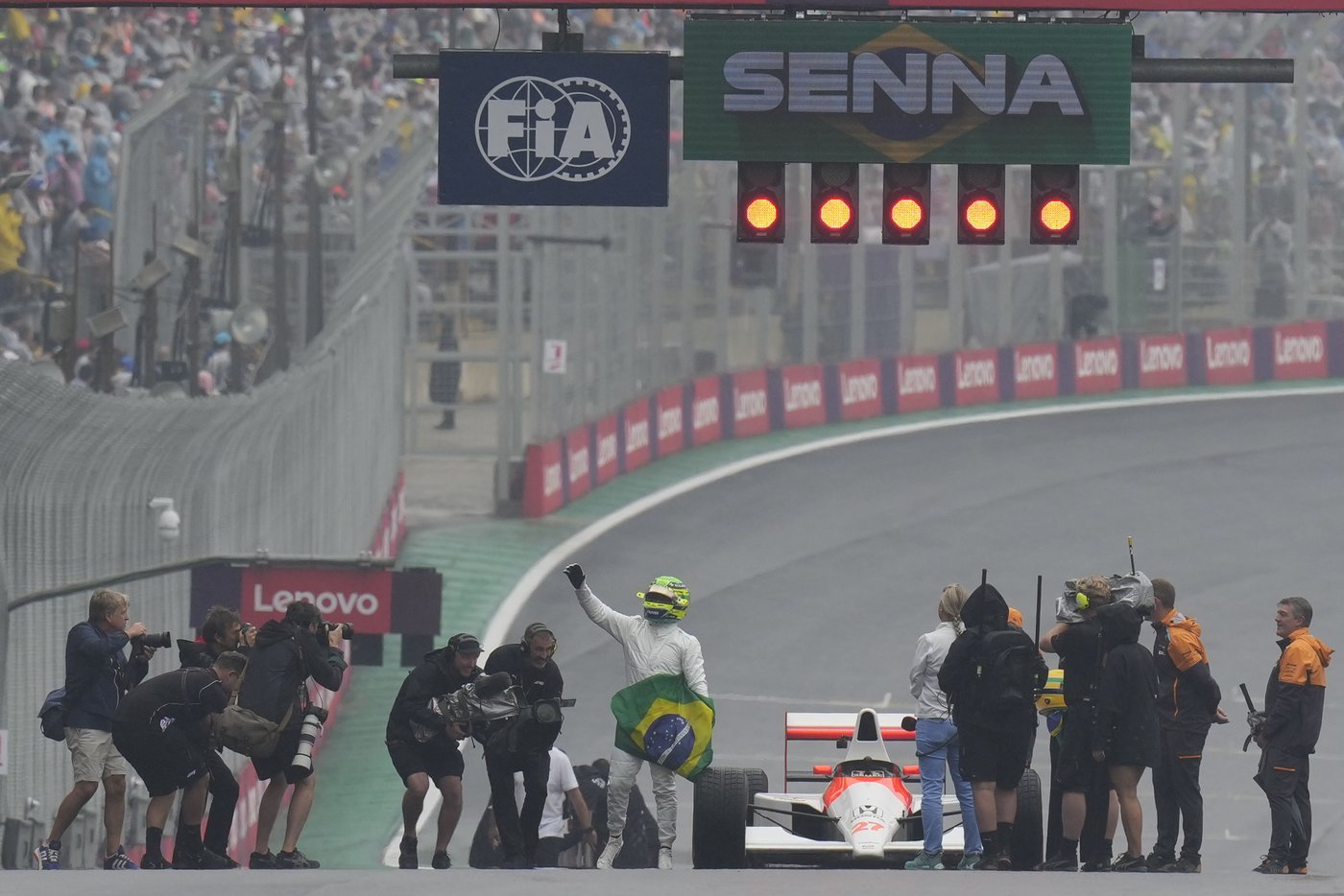 Emotional Hamilton drives Senna's car before Brazilian Grand Prix, regrets he can't race with it | iNFOnews.ca