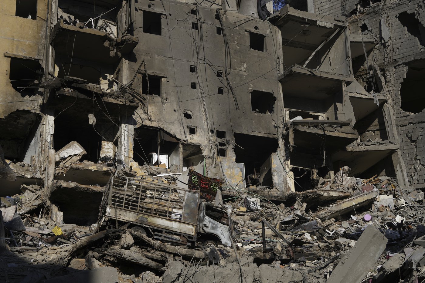 AP images offer a close-up look at the smoldering site of Nasrallah's assassination | iNFOnews.ca