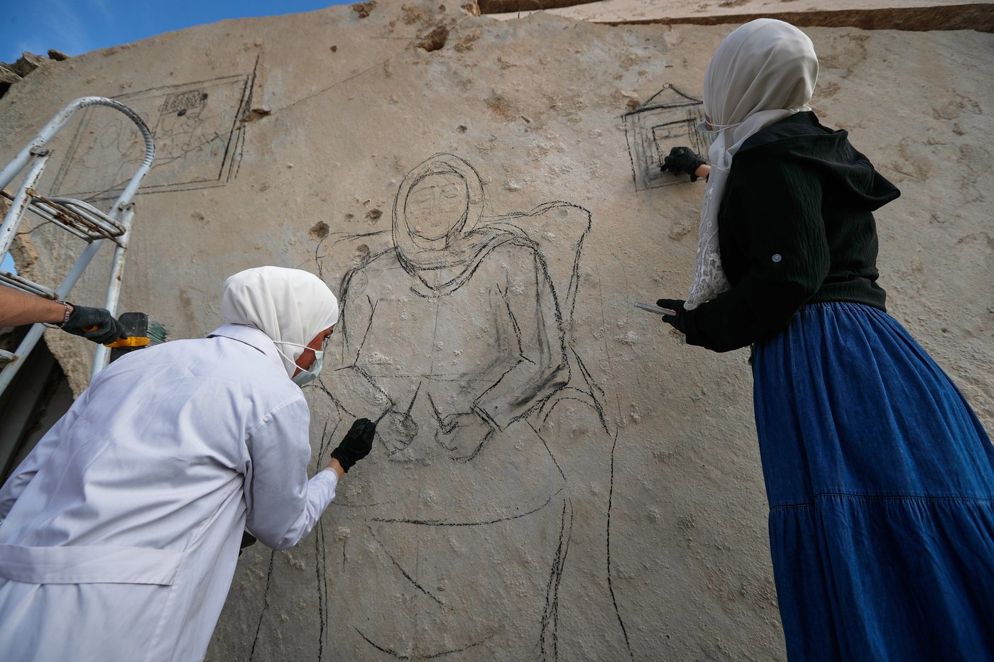Syrian artists transform bombed-out house into a mural of remembrance, in photos | iNFOnews.ca