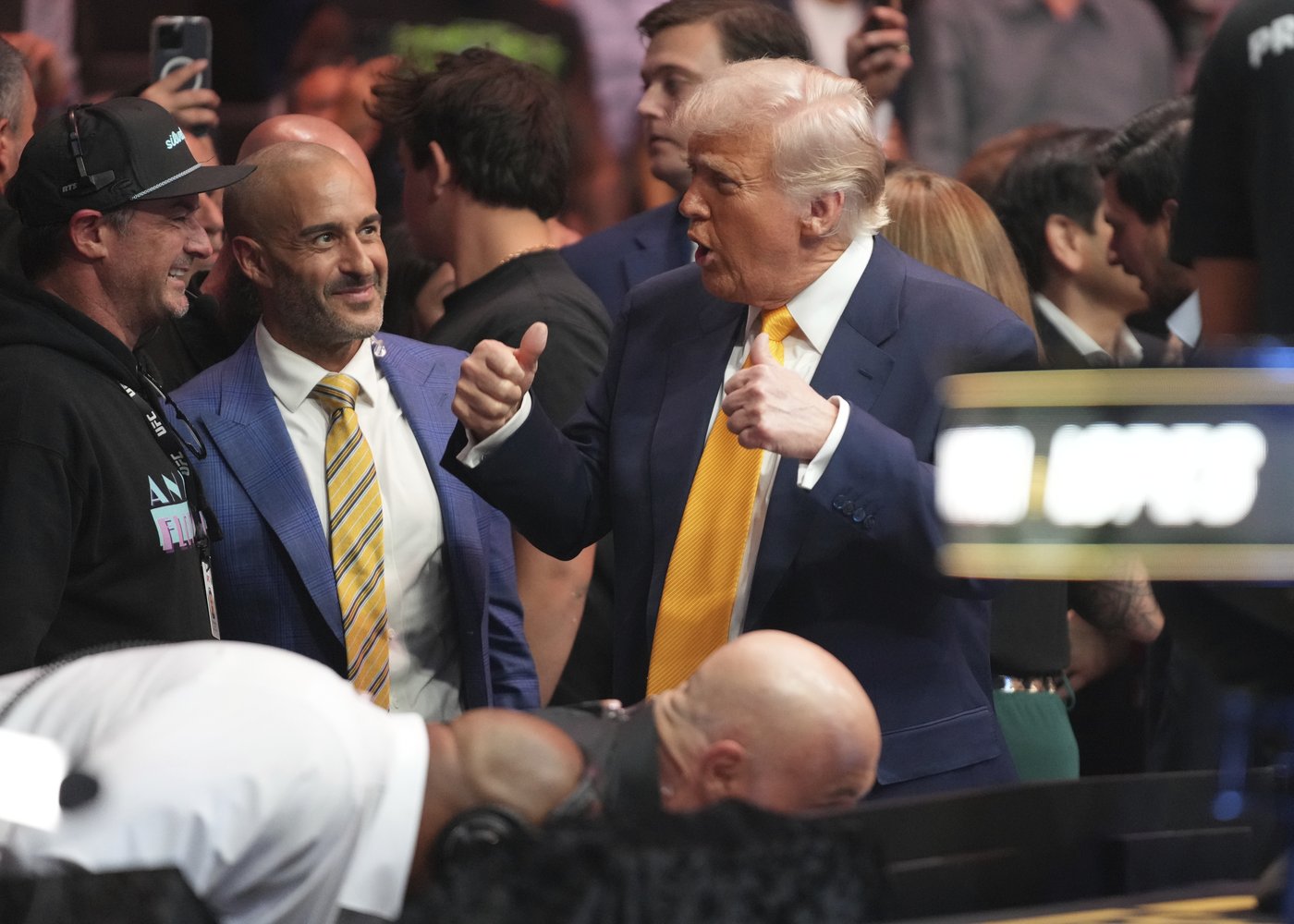 Trump sits cageside at Miami UFC event in his latest appearance at a sports event | iNFOnews.ca