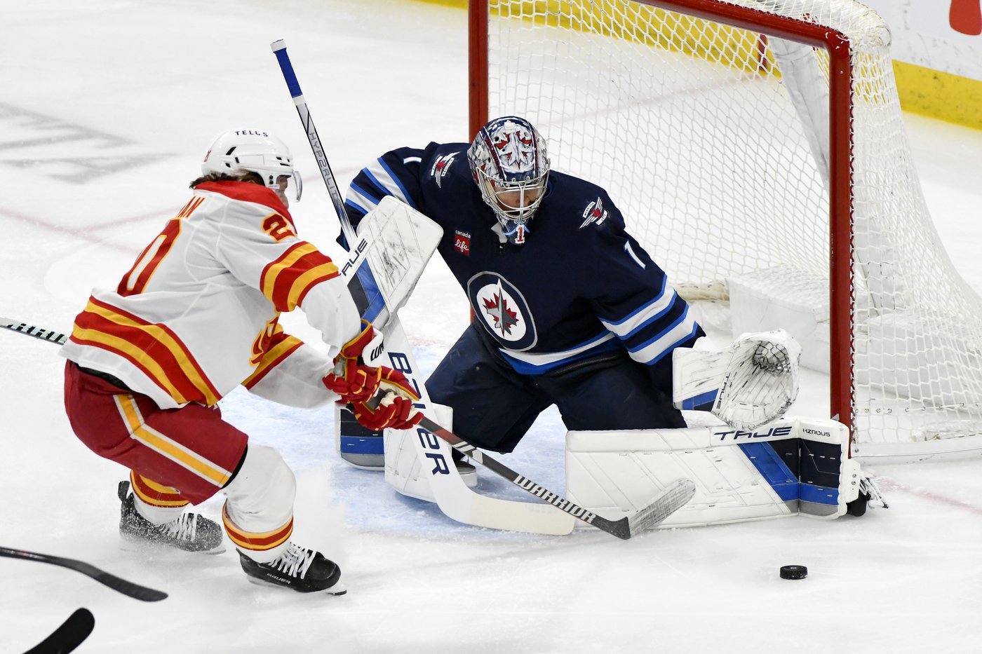 Jets' goaltender Comrie puts 'curse' to rest with 5-2 win over Flames | iNFOnews.ca