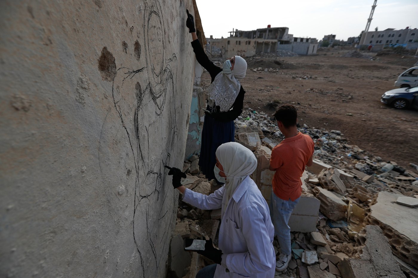 Syrian artists transform bombed-out house into a mural of remembrance, in photos | iNFOnews.ca
