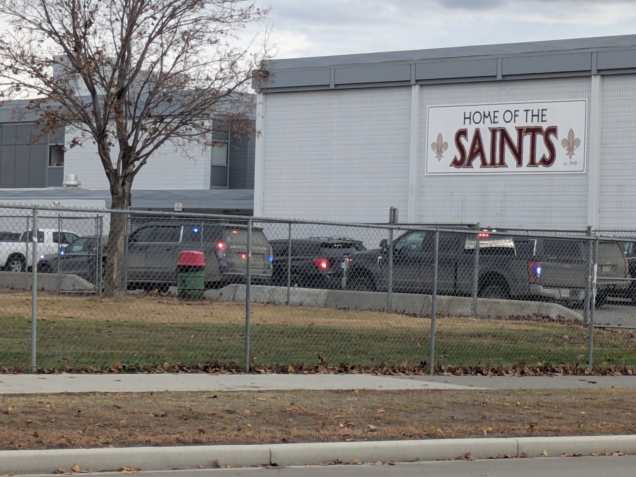 What happens when a BC school is locked down | iNFOnews.ca Exterior of a high school seen with multiple police vehicles in front.