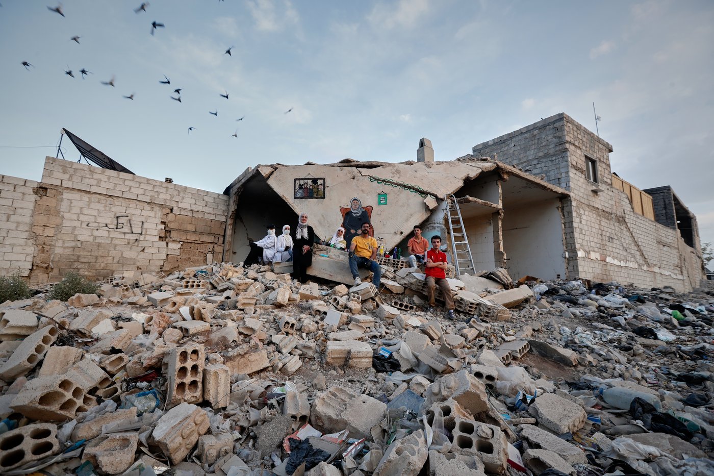 Syrian artists transform bombed-out house into a mural of remembrance, in photos | iNFOnews.ca